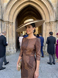 Sombrero Pamela Siena de paja beige con ala ancha y cinta oscura, usado.
